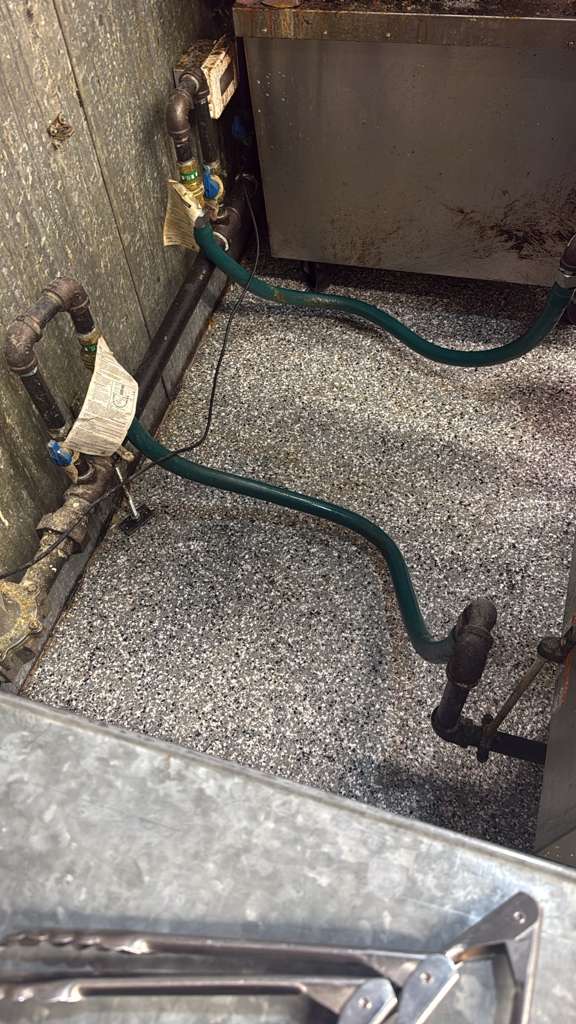 Same commercial kitchen pipe run and floor after Clear Shine deep cleaning